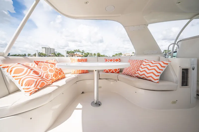 Sound Traveler Yacht Photos Pics Luxurious 2005 Carver 56 Voyager yacht interior with vibrant orange-patterned cushions.