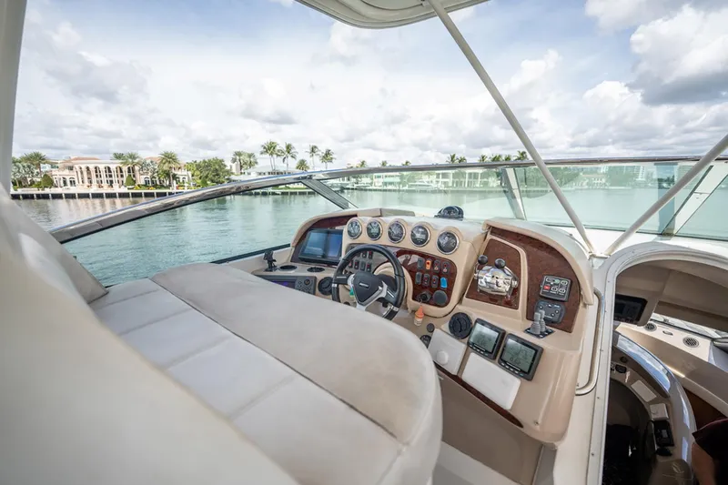 Sound Traveler Yacht Photos Pics 2005 Carver 56 Voyager yacht helm with luxurious interior and waterfront view.