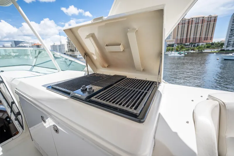 Sound Traveler Yacht Photos Pics Outdoor grill on 2005 Carver 56 Voyager yacht, with cityscape and water view.
