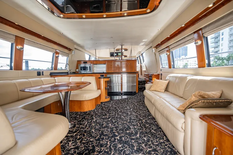 Sound Traveler Yacht Photos Pics Luxurious interior of 2005 Carver 56 Voyager yacht with elegant seating and modern kitchen amenities.