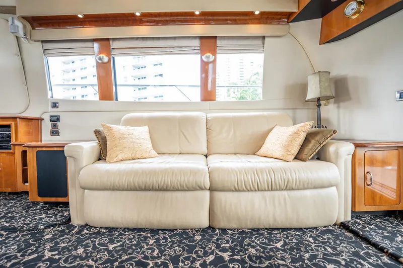 Sound Traveler Yacht Photos Pics Luxurious interior of 2005 Carver 56 Voyager yacht with plush sofa and elegant decor.