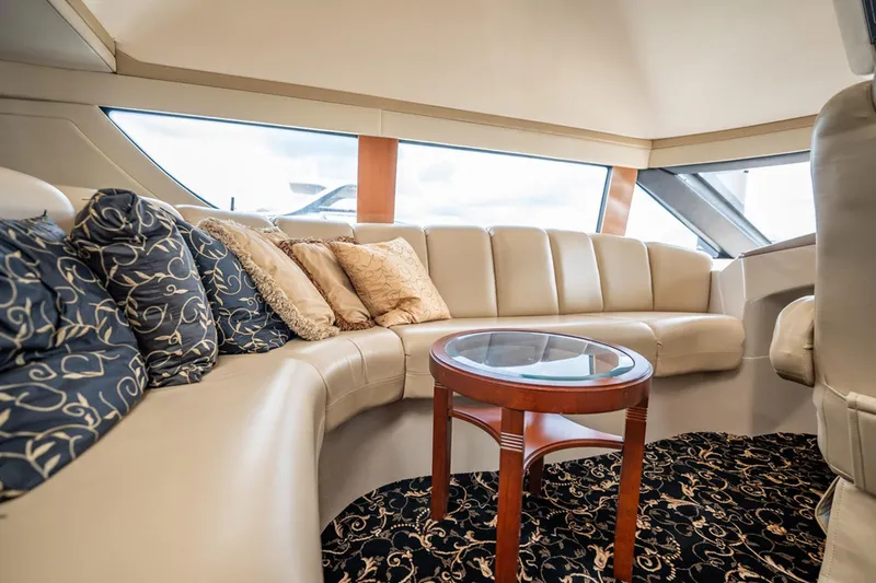 Sound Traveler Yacht Photos Pics Luxurious interior of a 2005 Carver 56 Voyager yacht with elegant seating and decor.