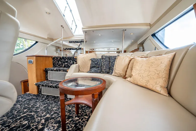 Sound Traveler Yacht Photos Pics Luxurious interior of 2005 Carver 56 Voyager yacht with elegant seating and decor.