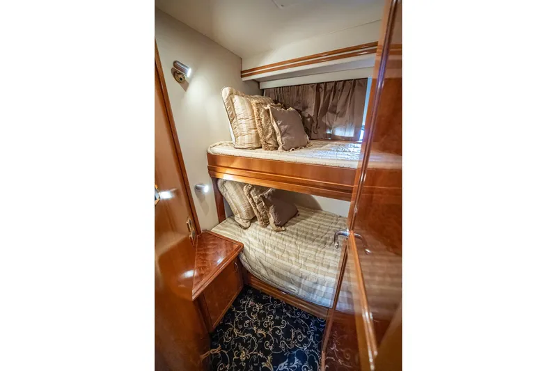 Sound Traveler Yacht Photos Pics Luxurious 2005 Carver 56 Voyager yacht cabin with cozy bunk beds and elegant decor.