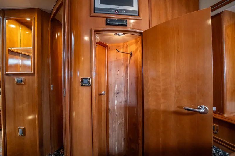 Sound Traveler Yacht Photos Pics Interior of 2005 Carver 56 Voyager yacht with wooden cabinetry and open door.
