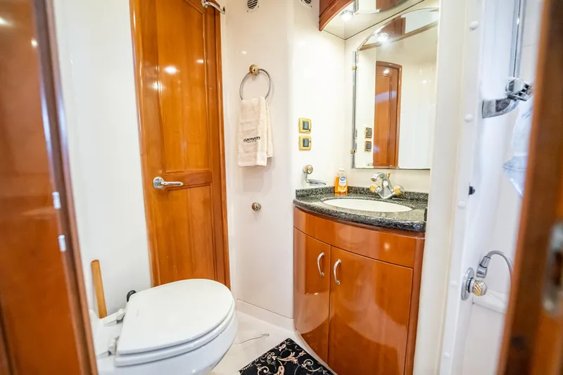 Sound Traveler Yacht Photos Pics Luxurious bathroom in 2005 Carver 56 Voyager yacht with wood accents and modern fixtures.