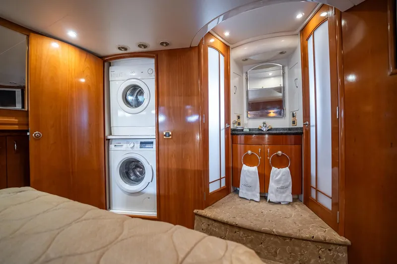 Sound Traveler Yacht Photos Pics Luxurious 2005 Carver 56 Voyager yacht interior with washer, dryer, and elegant bathroom.