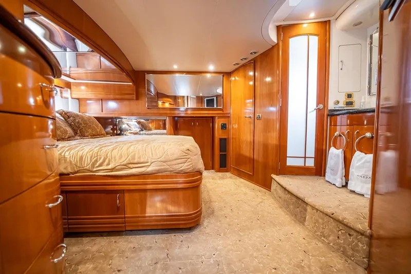 Sound Traveler Yacht Photos Pics Luxurious 2005 Carver 56 Voyager yacht interior with elegant wood finishes and cozy bedroom.
