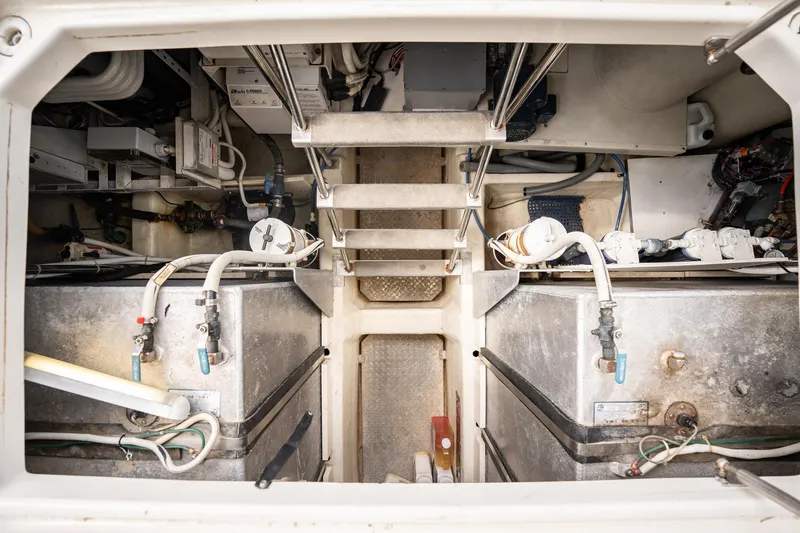 Sound Traveler Yacht Photos Pics Engine room of 2005 Carver 56 Voyager yacht, showcasing mechanical components and piping.