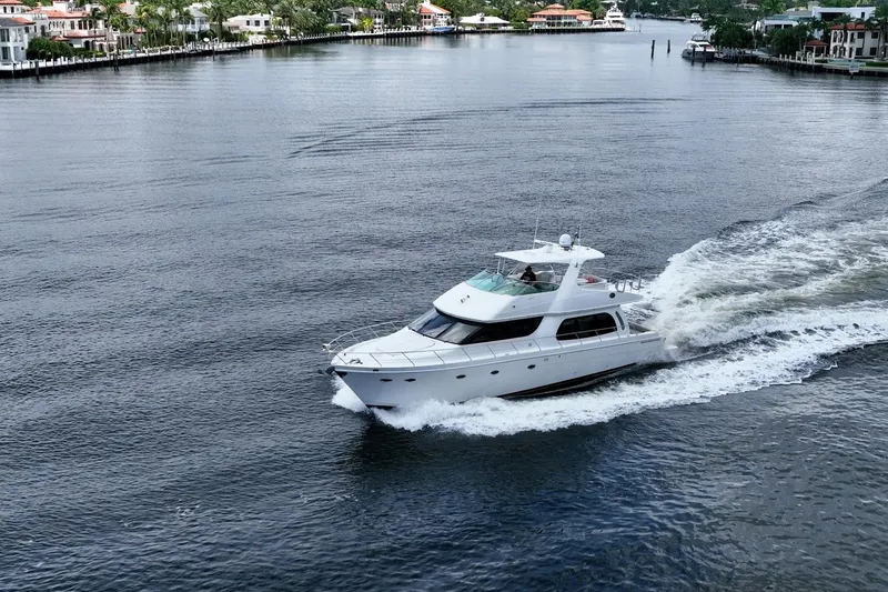 Sound Traveler Yacht Photos Pics 2005 Carver 56 Voyager yacht cruising on a scenic waterway.