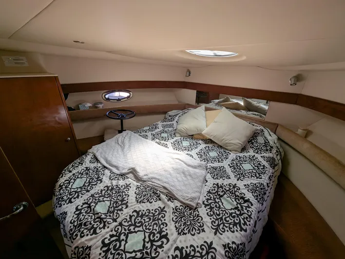 Dakota Silver Yacht Photos Pics Luxurious 2006 Meridian 368 yacht bedroom with patterned bedding and cozy lighting.