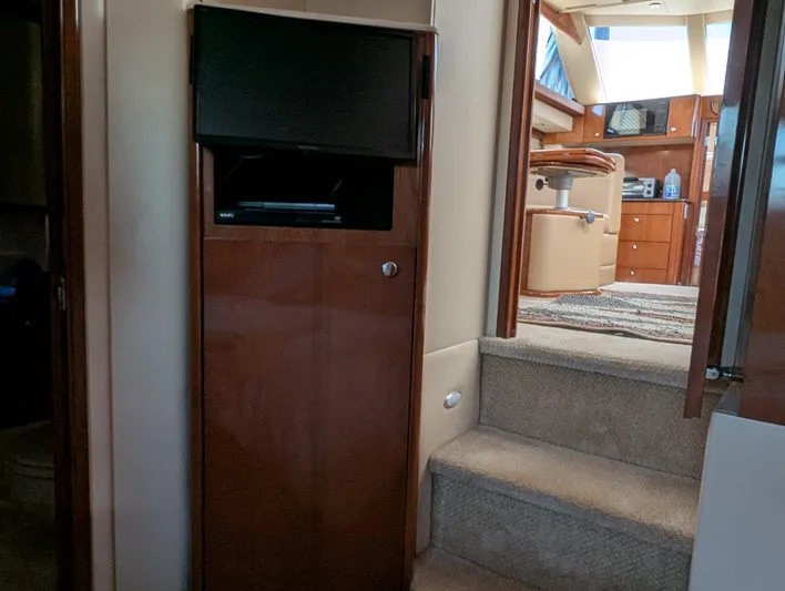 Dakota Silver Yacht Photos Pics Interior of 2006 Meridian 368 yacht with TV and steps to cabin.