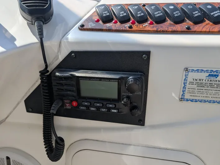 Dakota Silver Yacht Photos Pics Control panel of a 2006 Meridian 368 yacht with radio and switches.