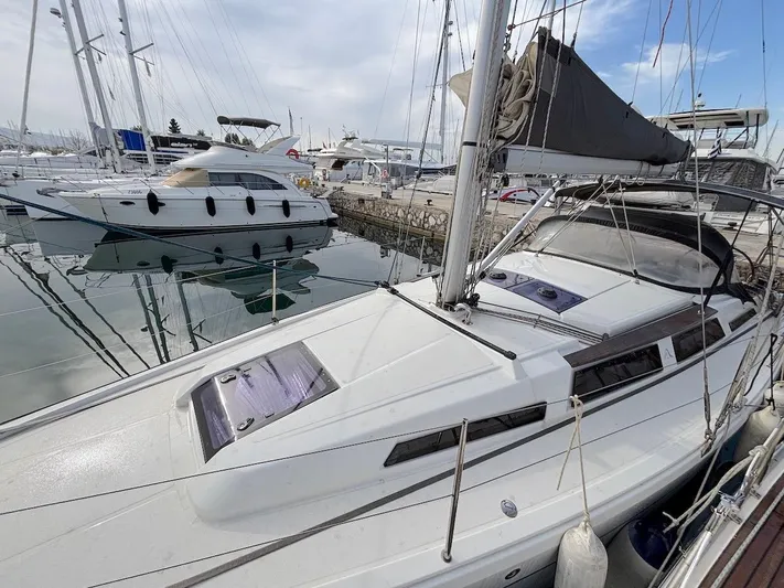 Sunshine Yacht Photos Pics 2014 Hanse 345 sailboat docked in marina, featuring sleek design and modern rigging.