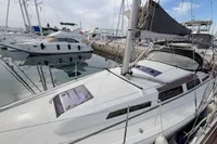 2014 Hanse 345 sailboat docked in marina, featuring sleek design and modern rigging.