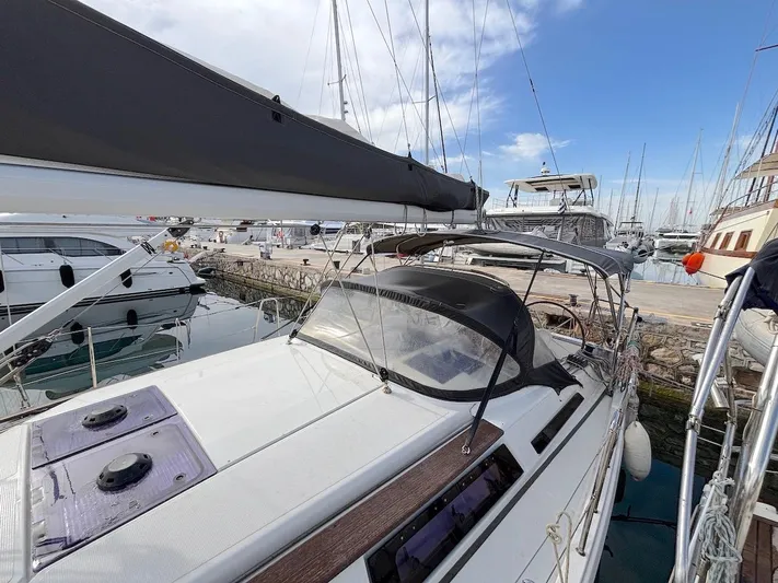 Sunshine Yacht Photos Pics 2014 Hanse 345 sailboat docked at marina, featuring sleek design and spacious deck.