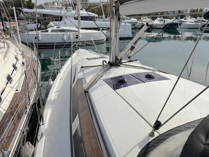 Sunshine Yacht Photos Pics 2014 Hanse 345 sailboat docked in marina, surrounded by other yachts.