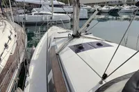 2014 Hanse 345 sailboat docked in marina, surrounded by other yachts.