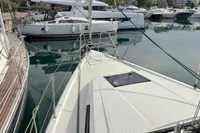 Sailboats docked in a marina, featuring a 2014 Hanse 345 in the foreground.