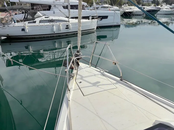 Sunshine Yacht Photos Pics Sailboat Hanse 345, 2014 model, docked in a marina with calm waters.
