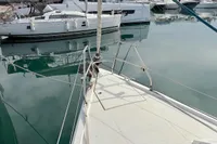 Sailboat Hanse 345, 2014 model, docked in a marina with calm waters.