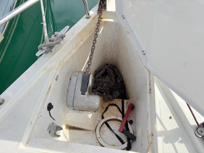 Sunshine Yacht Photos Pics Anchor locker of 2014 Hanse 345 sailboat with chain and tools.