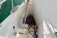 Anchor locker of 2014 Hanse 345 sailboat with chain and tools.