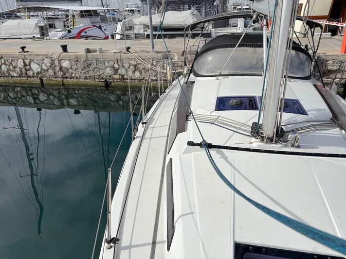 Sunshine Yacht Photos Pics 2014 Hanse 345 sailboat docked at marina, showing deck and rigging.