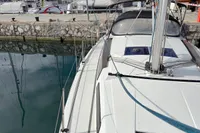 2014 Hanse 345 sailboat docked at marina, showing deck and rigging.