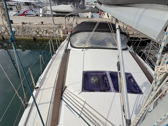 Sunshine Yacht Photos Pics 2014 Hanse 345 sailboat docked, featuring a sleek deck and modern design.