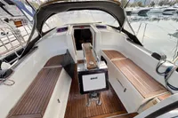 Cockpit of 2014 Hanse 345 sailboat with wooden seating and steering console.