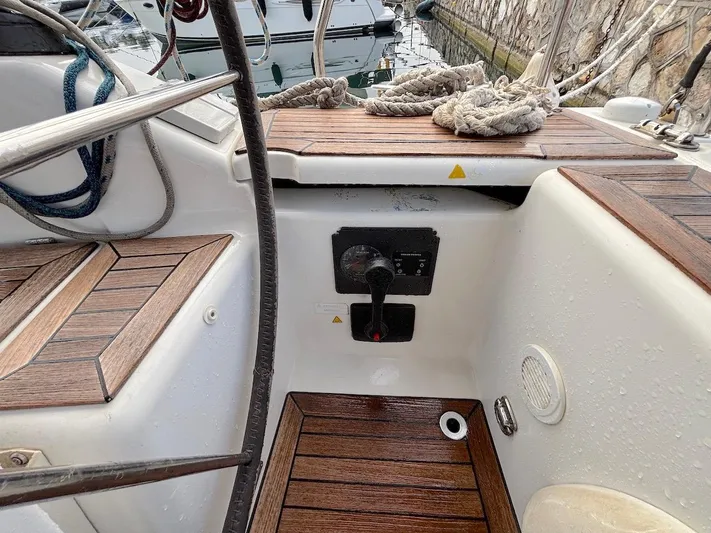 Sunshine Yacht Photos Pics Cockpit of 2014 Hanse 345 sailboat with wooden flooring and control panel.