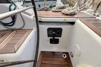 Cockpit of 2014 Hanse 345 sailboat with wooden flooring and control panel.