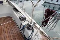 Hanse 345 sailboat deck with winch and ropes, 2014 model, docked at marina.