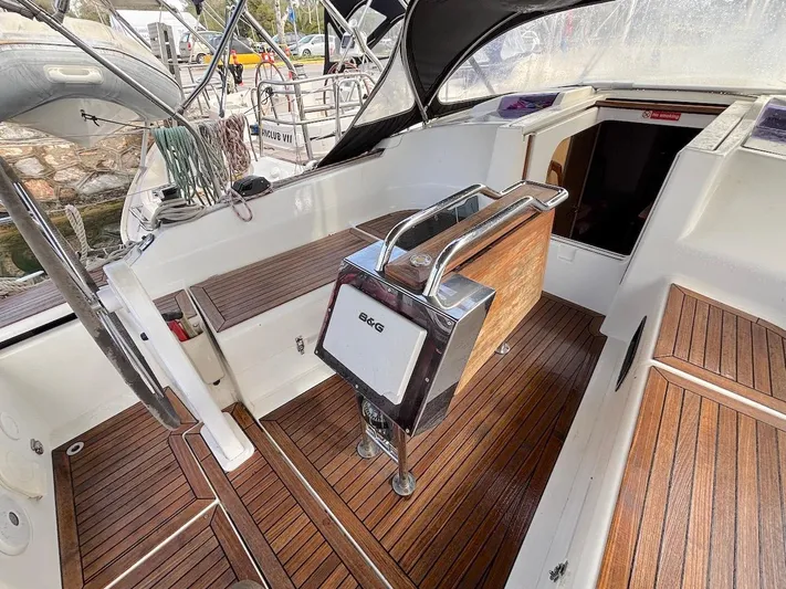 Sunshine Yacht Photos Pics 2014 Hanse 345 yacht cockpit with wooden flooring and steering wheel.