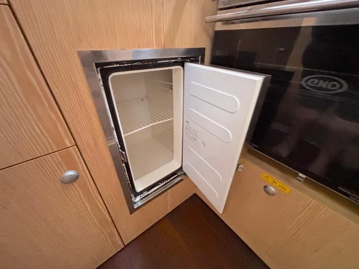 Sunshine Yacht Photos Pics Open mini fridge in 2014 Hanse 345 yacht kitchen interior.