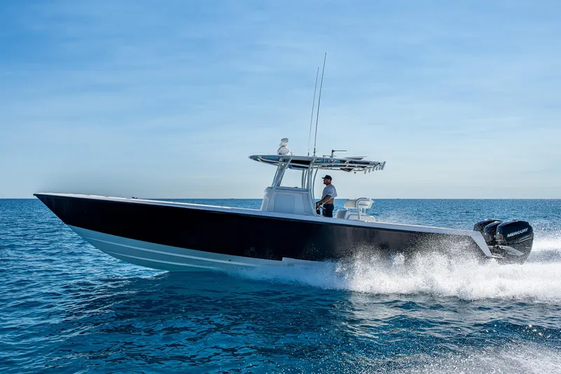  Yacht Photos Pics 2017 Contender 39 ST boat cruising on open water.