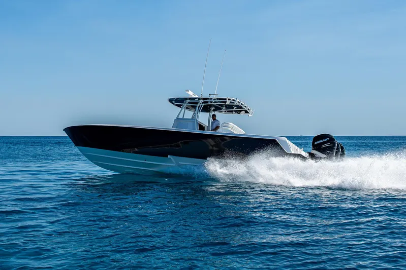  Yacht Photos Pics 2017 Contender 39 ST boat cruising on open blue water.