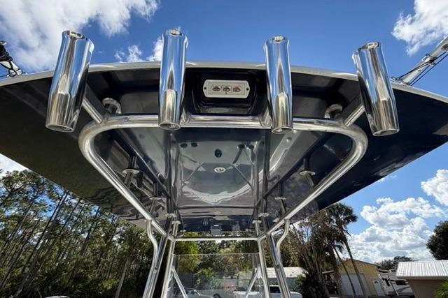 Stuart 27 boat T-top with rod holders, 2017 model, under a clear blue sky.