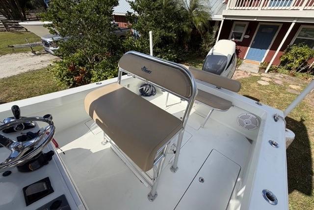 Stuart 27 boat, 2017 model, featuring a spacious deck with seating and steering console.