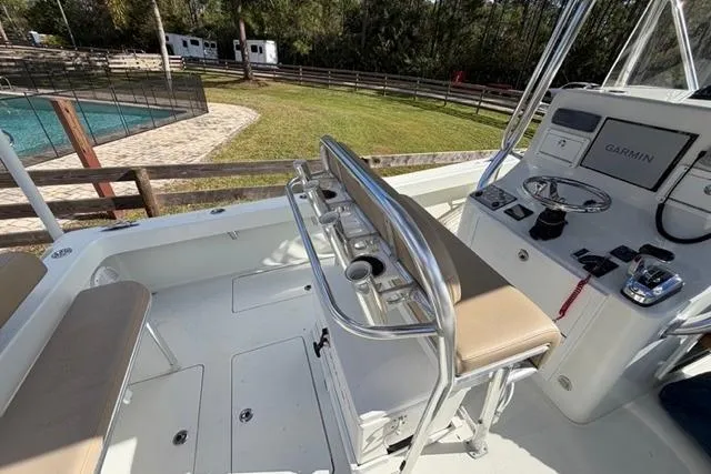  Yacht Photos Pics Interior of a 2017 Stuart 27 boat with seating and control panel.