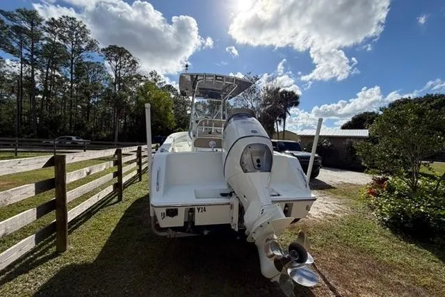  Yacht Photos Pics Stuart 27 boat, 2017 model, parked outdoors under a partly cloudy sky.