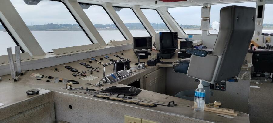 Control room of 1981 Custom Victory 11 ship with navigation equipment and panoramic windows.