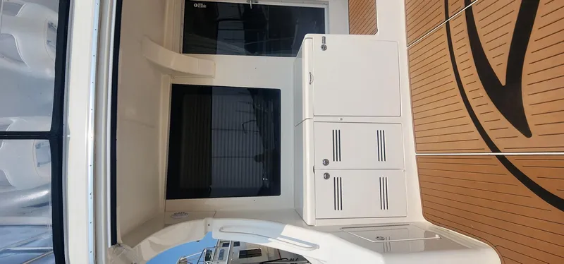  Yacht Photos Pics 2004 Silverton 48 Convertible yacht interior with white cabinetry and wooden flooring.