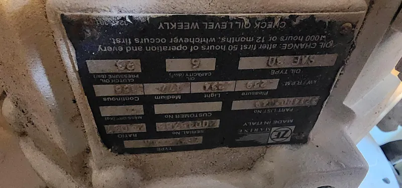  Yacht Photos Pics Close-up of a 2004 Silverton 48 Convertible engine label with maintenance instructions.