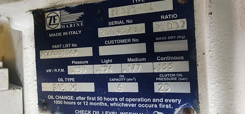  Yacht Photos Pics Label on ZF Marine engine, detailing specifications and oil change instructions.