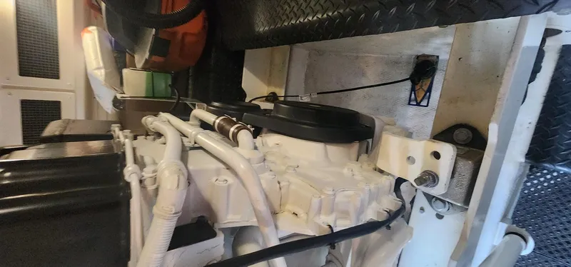  Yacht Photos Pics Engine room of a 2004 Silverton 48 Convertible yacht, showcasing mechanical components.