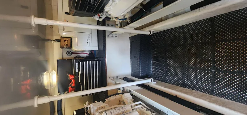  Yacht Photos Pics Engine room of a 2004 Silverton 48 Convertible yacht, featuring equipment and storage.