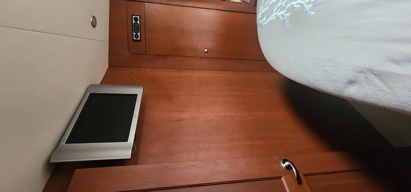  Yacht Photos Pics 2004 Silverton 48 Convertible interior with wood paneling and mounted screen.