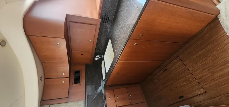  Yacht Photos Pics 2004 Silverton 48 Convertible yacht interior with wooden cabinetry and modern design.